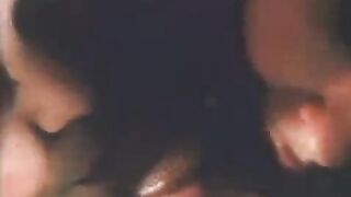 A beautiful woman makes blowjob to her lover in an old video