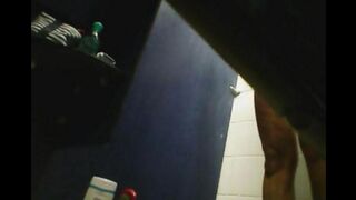 A hidden camera in the shower captures a girl's shaved pussy