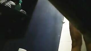 A hidden camera in the shower captures a girl's shaved pussy