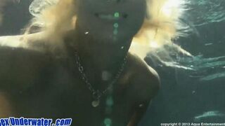Blonde makes a blowjob right in the water