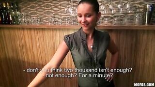 A beautiful girl is working as a bartender and she is doing it perfectly well