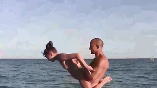 Nude acrobats have a great time on the beach