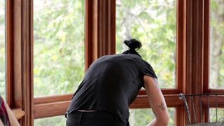 A sexy Vietnamese girl was fucked in the kitchen by a passionate lesbian with a strap-on