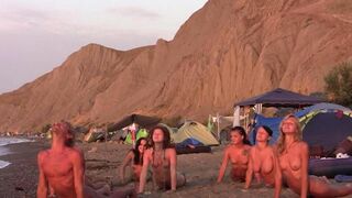 A volleyball game turns into a naked one on the beach