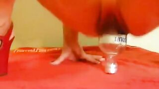 Fisting with a large dildo and a bottle in the ass hole