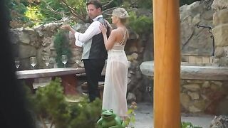 A blonde is having fun with her new husband on honeymoon