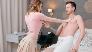 A pair of lovers have an intimate conversation while lying on the bed completely naked
