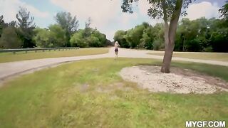 A couple is having fun on the city park, enjoying the outdoors