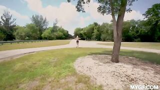 A couple is having fun on the city park, enjoying the outdoors
