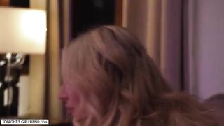 Busty blonde Kayley Gunner gives a foot job through stockings