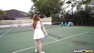 The girl is having fun with her tennis coach on the tennis court