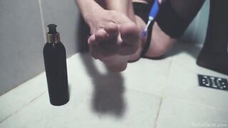 A girl washes her shaved pussy in the shower and plays with toys