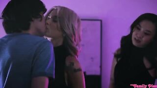 An Asian girl and a blonde are having fun with a European guy