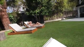 A couple enjoys outdoor intimacy in their summer house garden