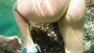 Babe fucked in her ass under the water on a beach with a creampie