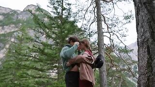 A couple engaged in passionate sex right in the forest, surrounded by nature