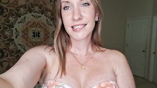 A busty brunette gives a sensual massage with shimmering oil, showcasing her skills in a steamy JOI session