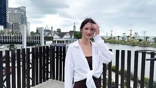 A signal of distress from a beautiful woman in a bikini