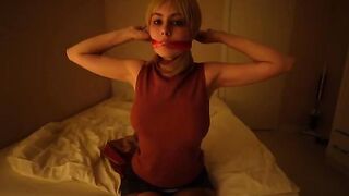 Girl with big tits masturbates using a toy, embodying Resident Evil’s bold style