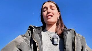 A hot brunette babe masturbates on the public beach