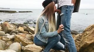 A sexy blonde girl makes blowjob on the city streets