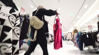 The pretty girl almost gets caught while giving a blowjob in the fitting room
